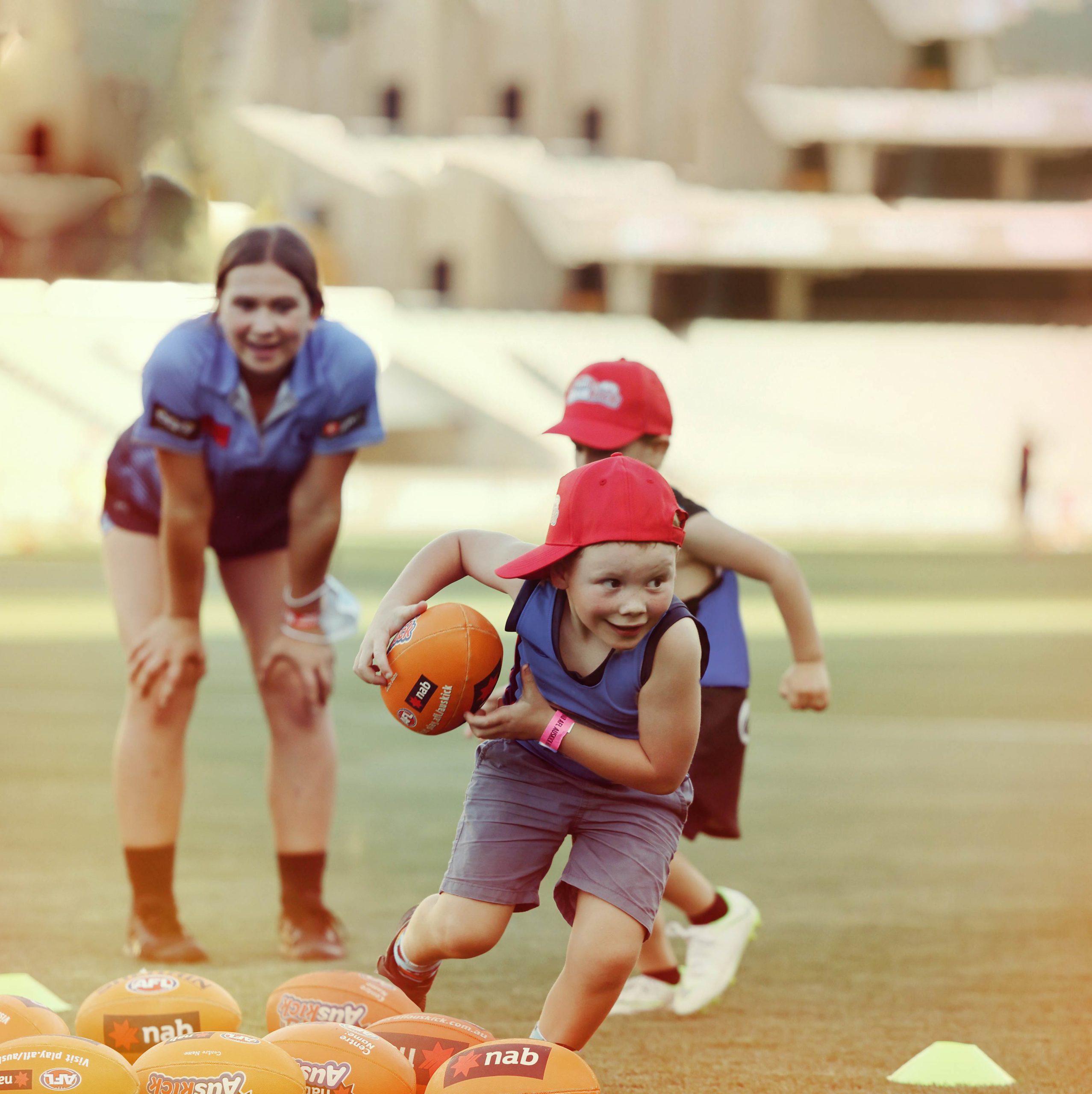 Thousands of junior players to take part in Gather Round Footy Clinics